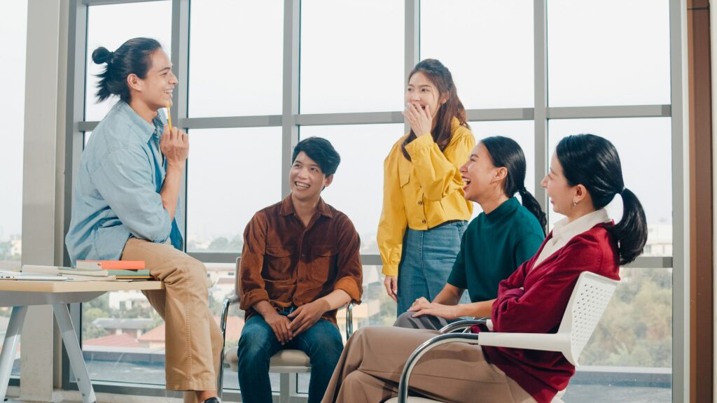 group-young-college-students-smart-casual-wear-campus-friends-brainstorming-meeting-talking-discussing-work-ideas-new-design-project-modern-office-coworker-teamwork-startup-concept-min